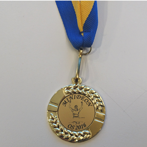 Snygg guldmedalj med gravering