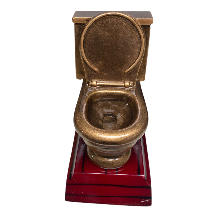 Rolig statyett i form av en toalettstol